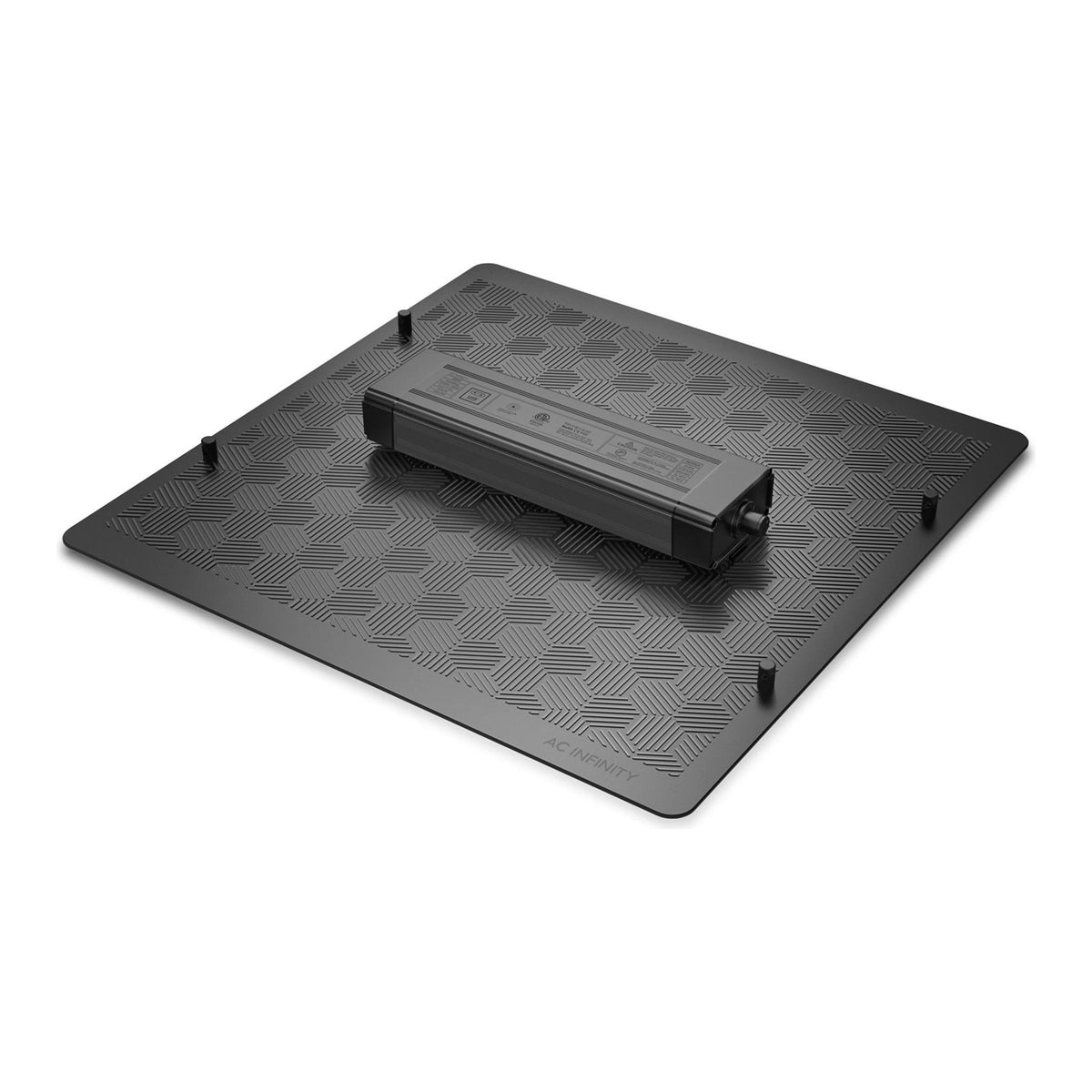 A black AC Infinity grow light sits on a patterned mat.