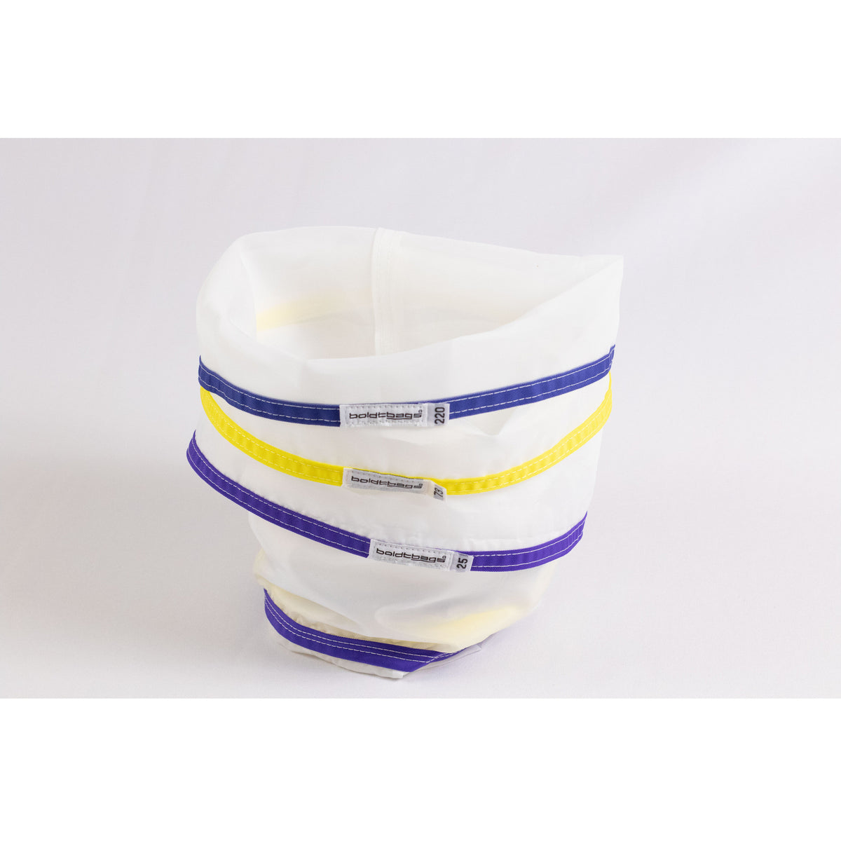 Three white mesh bags with blue, yellow, and purple trim stacked, logo visible.