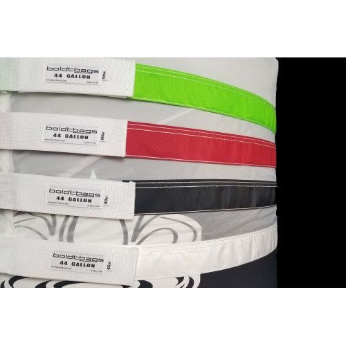 Stack of colorful, labeled Boldtbags 44 gallon mesh stackers in green, red, black, and white.