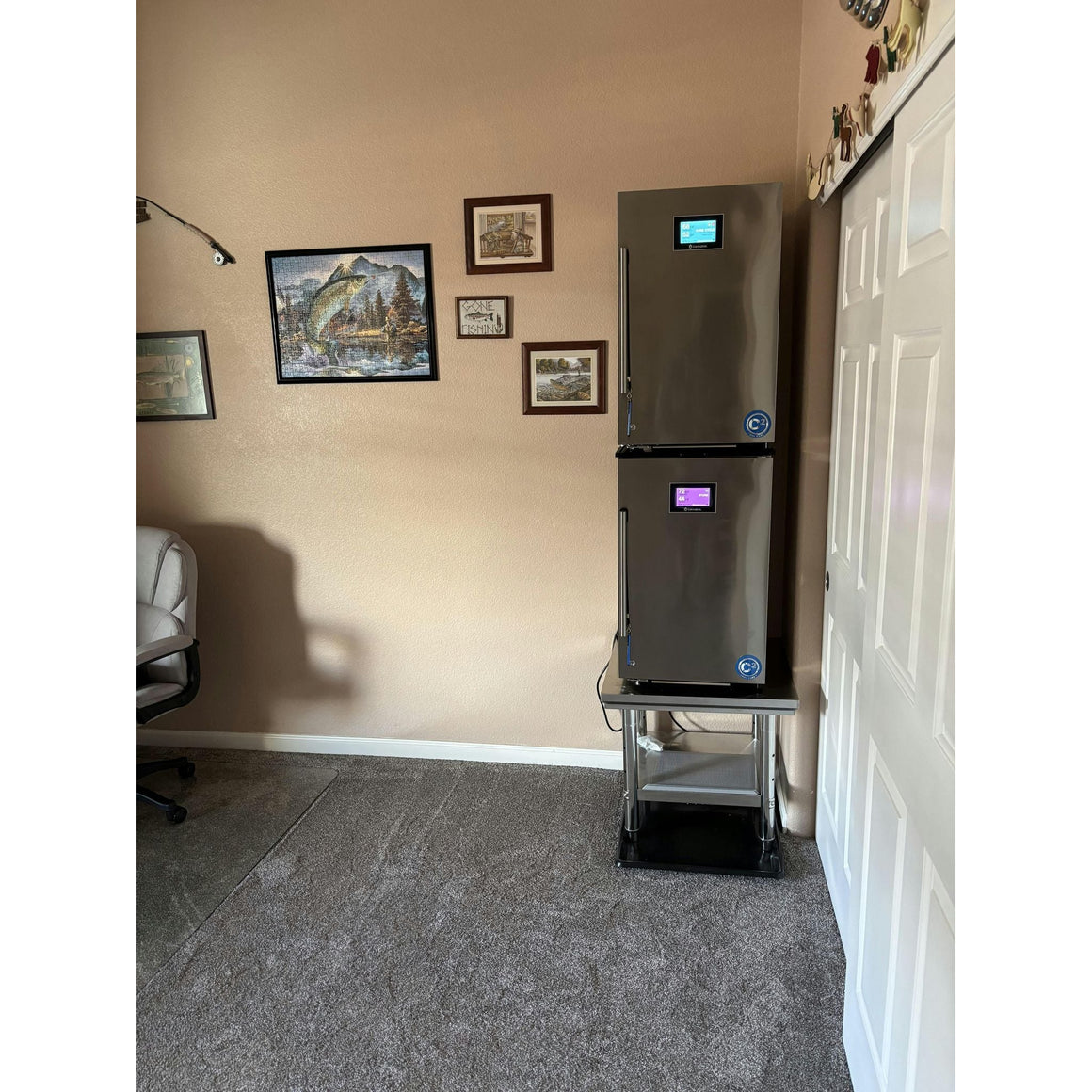 Cannatrol C2 drying and curing system with digital display in a room with fishing-themed decor.