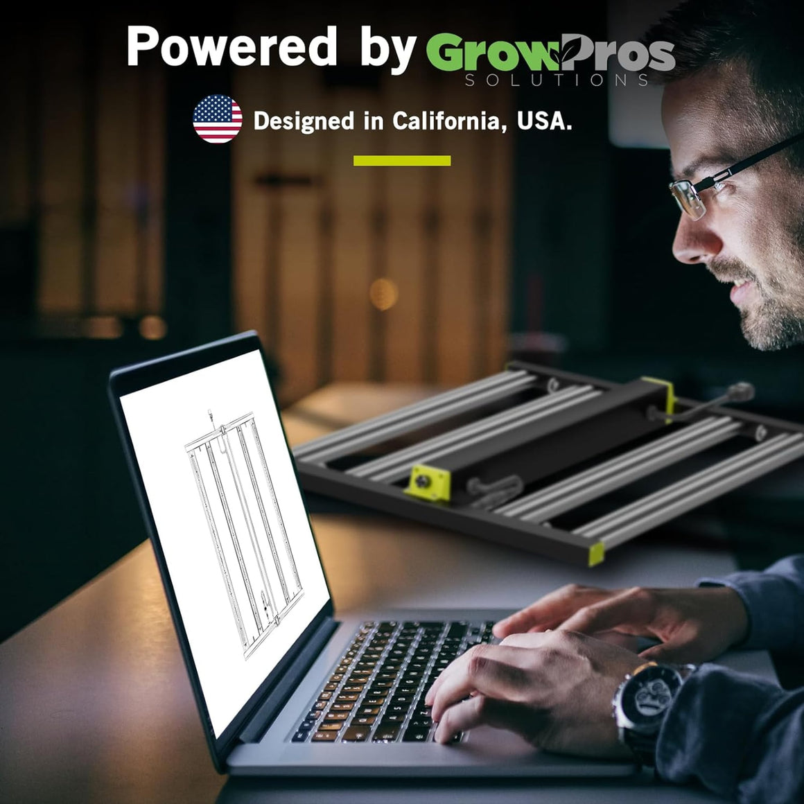A person works on a laptop displaying a diagram of a grow light, next to a real grow light.