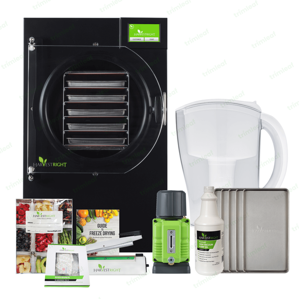 Harvest Right freeze dryer with accessories: trays, pump oil, filter, Mylar bags, and guide.