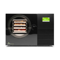 Black Harvest Right Countertop 360 freeze dryer, front view with four loaded trays behind the round door