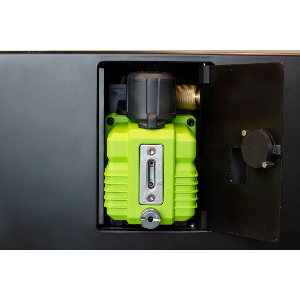 Green vacuum pump behind the access door of the Countertop 360, with the oil sight glass on its front