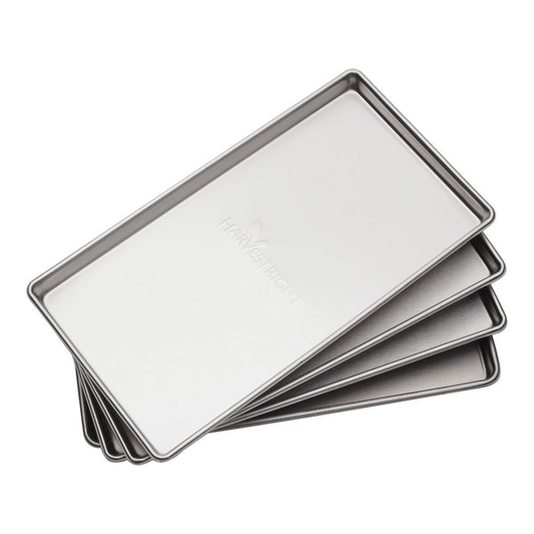 Stack of four stainless steel freeze dryer trays with Harvest Right logo.