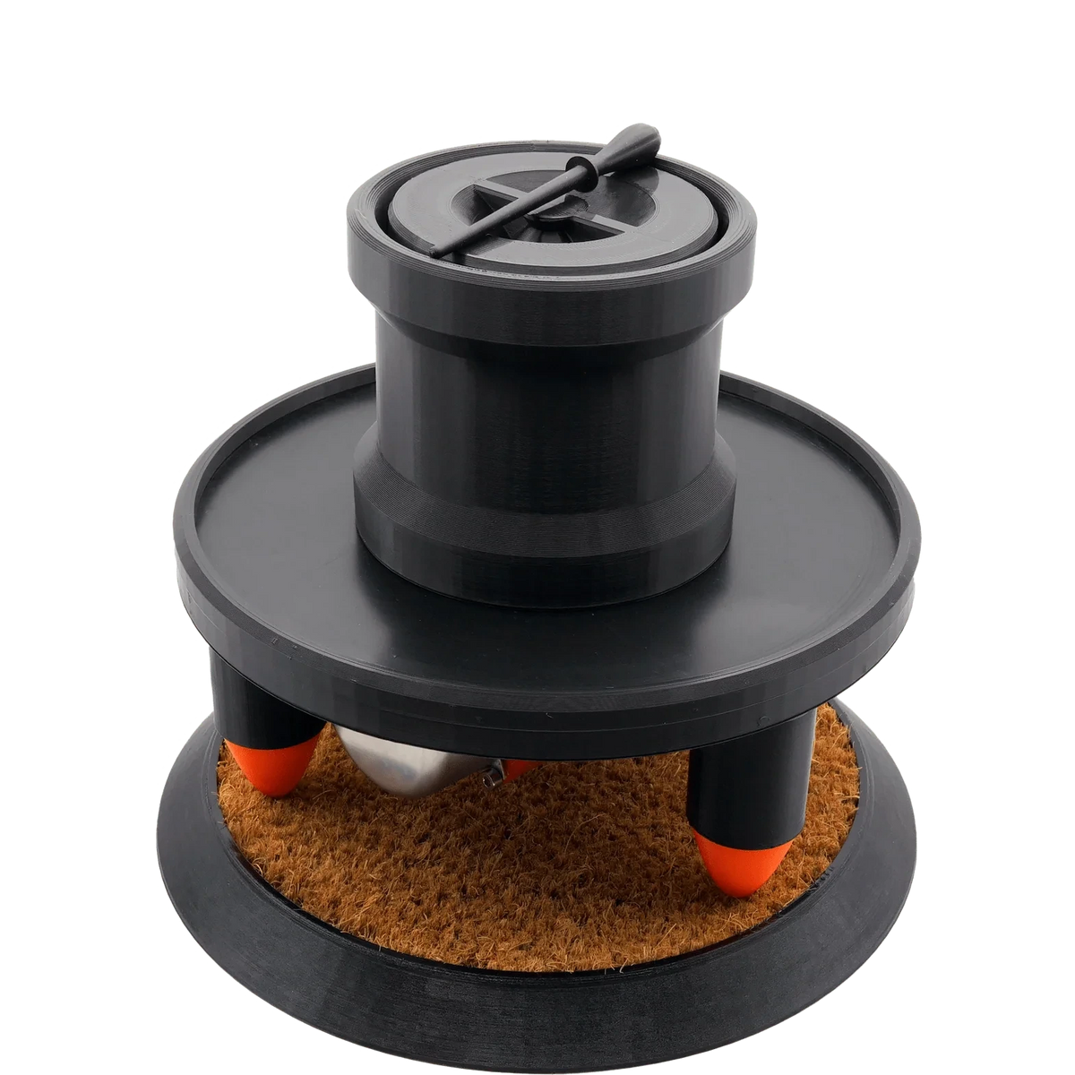 Humboldt cone filling machine, black with a tamper on its lid, orange-tipped legs, and a textured brown base.