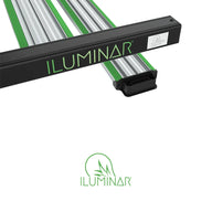 ILUMINAR iLogic MS Plus 1050W LED grow light with black housing, green branding, and multiple green & silver bars.