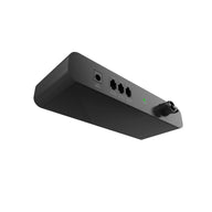 A sleek, dark gray or black electronic control device, likely an adapter or interface, shown from a low-angle perspective against a bright white background. It features a DC INPUT port, three RJ-style ports labeled 