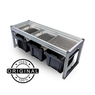 A sleek aluminum frame holds three black bins, with a metal grate on top, on a black background.