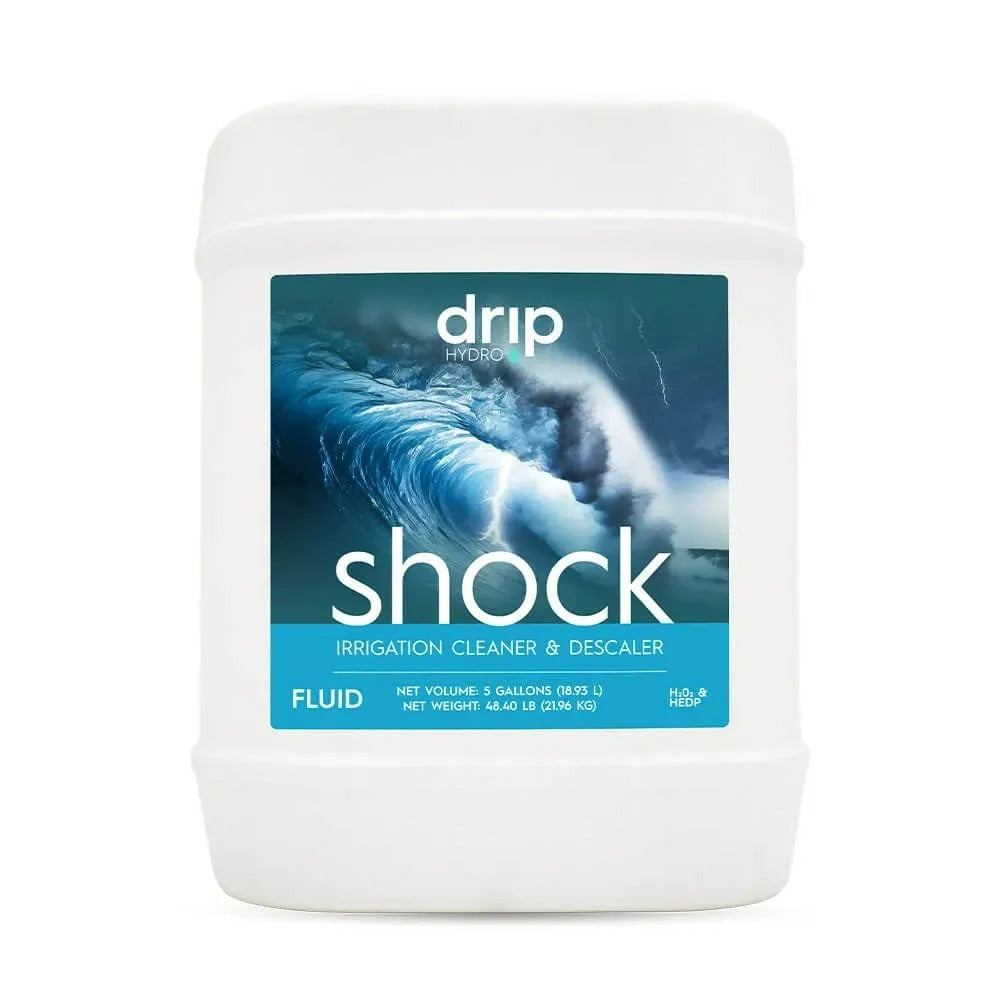 Drip Hydro Shock 5-gallon jug with a label featuring a crashing wave and "IRRIGATION CLEANER & DESCALER" text.