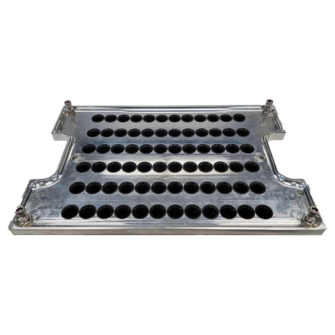 Silver metal tray with many small black circles in rows.