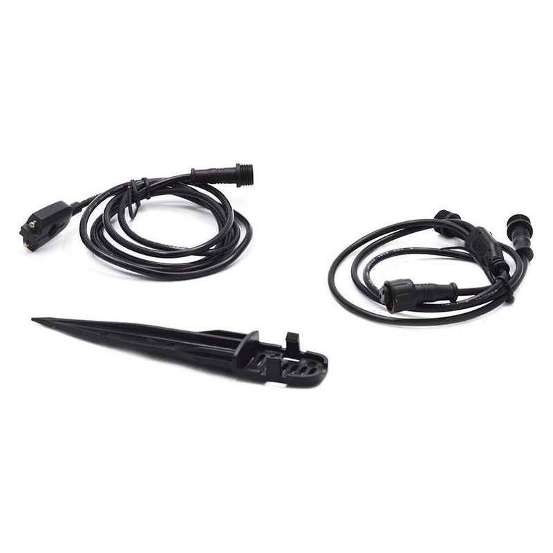 Black garden lights' power cables and stake on white background
