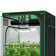 Vivosun Smart Grow Tent Kit, black & green, with exhaust fan, LED grow light, digital controller, & flowering plants.