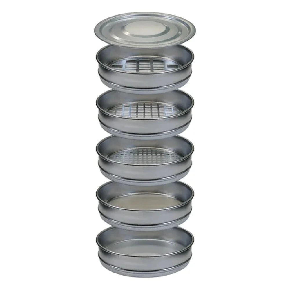 Stack of metal sieves with mesh screens and a lid, used for sorting.