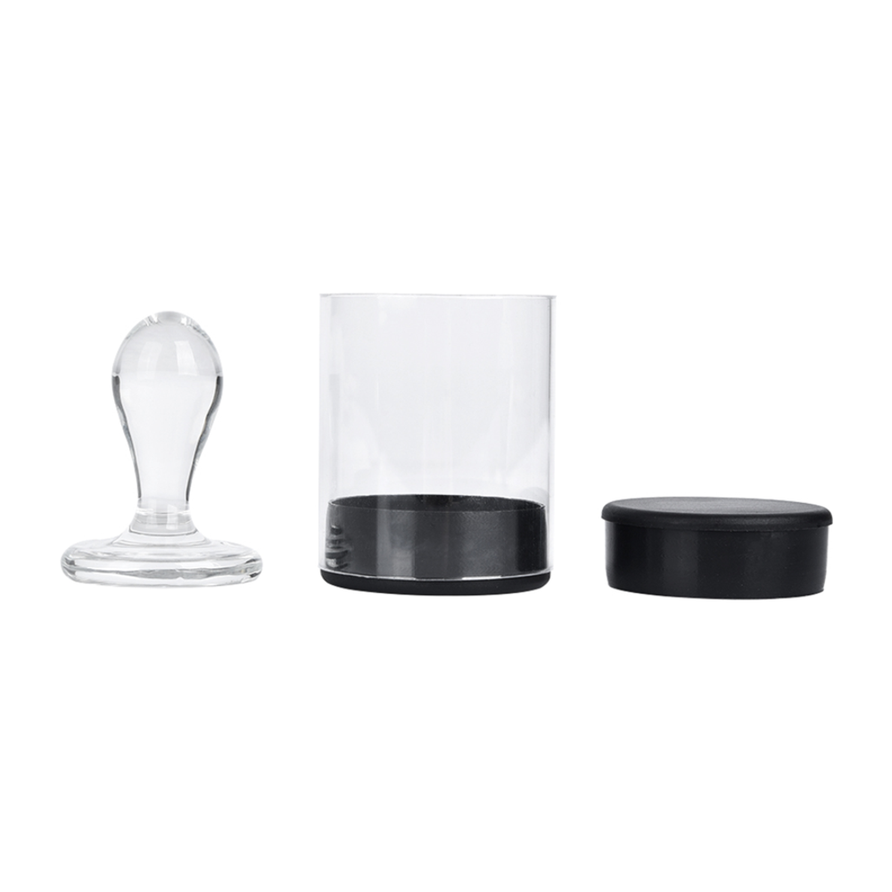 Clear glass stamp with black base, clear glass cup with black base, and black lid.