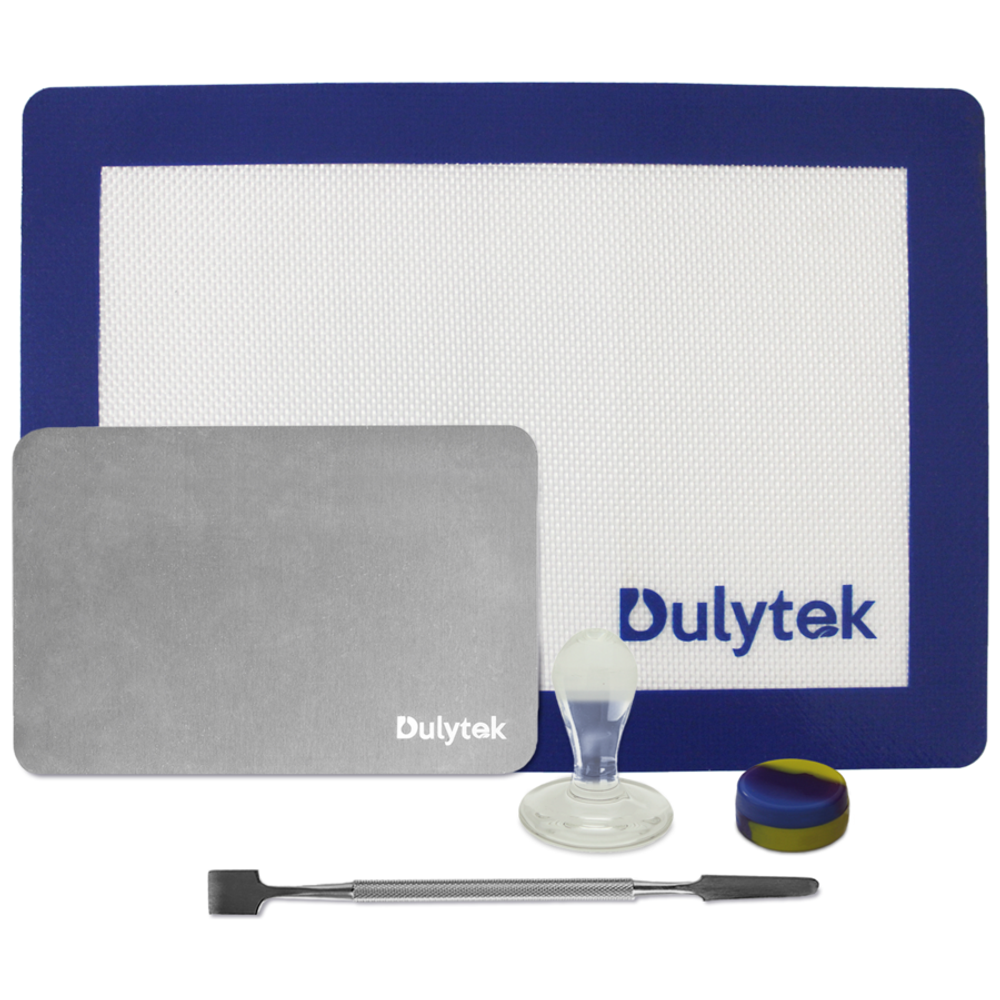 Dulytek rosin collection set with blue mat, grey slab, dab tool, silicone container, and glass stamp.