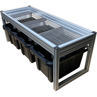 A silver aluminum frame holding a grate over three black bins.