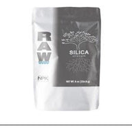 A white and gray pouch of RAW SILICA STRENGTH plant nutrient, showing a tree with roots.
