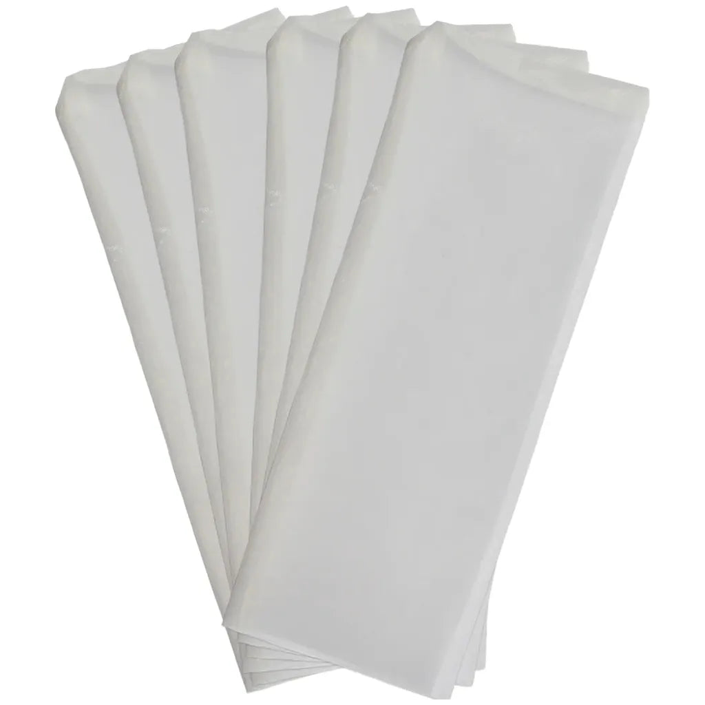 A stack of six white, rectangular filter bags, fanned out against a white background.