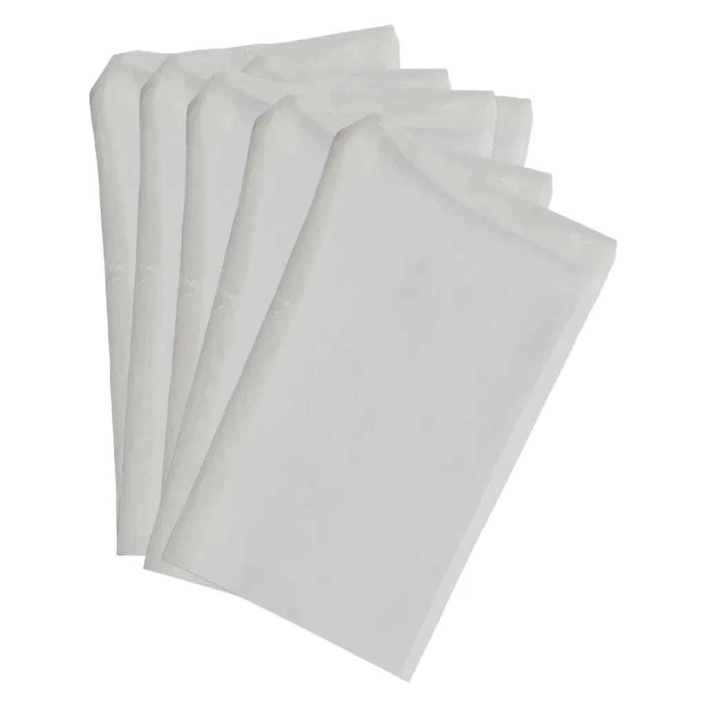 A fan of five white filter bags with a textured surface, fanned out against a white background.