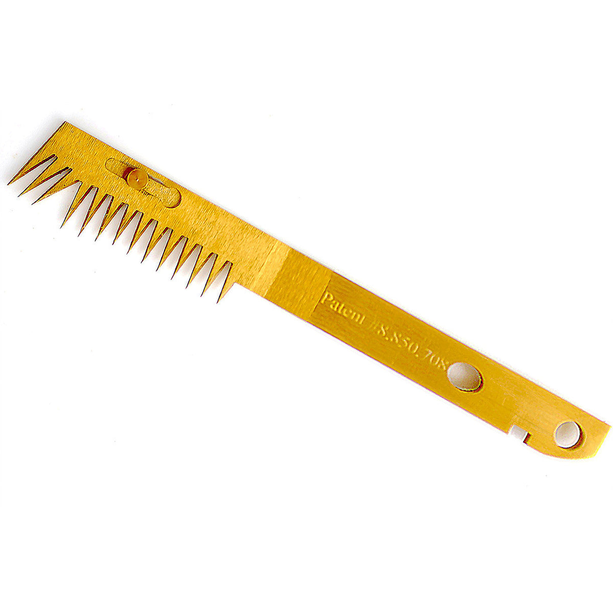 A golden razor comb with a patent number etched on it.