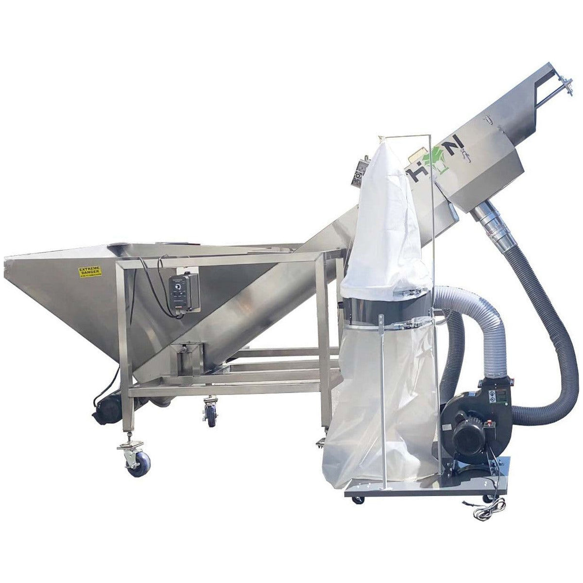 Stainless steel tumble trimmer with dust collection bag and blower.